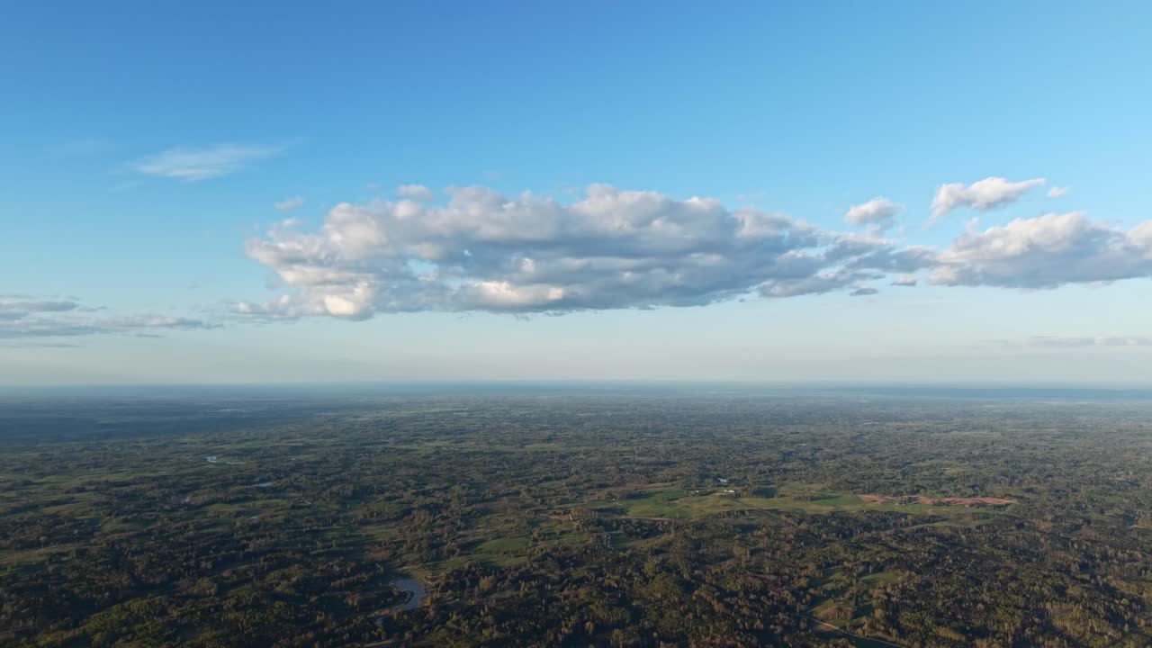 Daytime soft hazey sky of mountains and valleys, high aerial panoramic