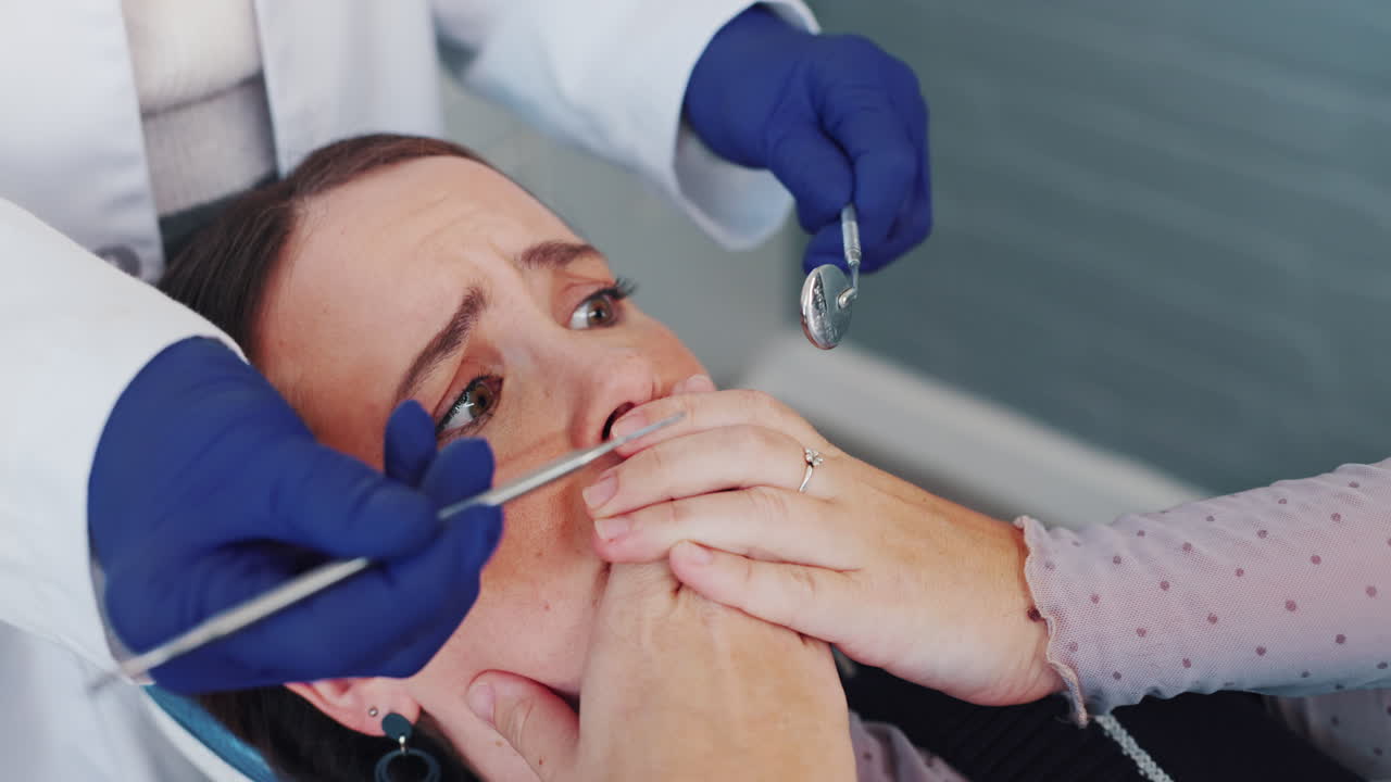 Woman experiencing fear at the dentist