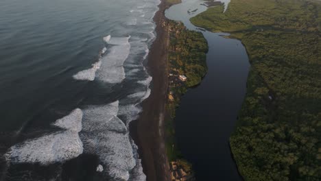 Tilt-up-shot-El-Paredon-City-In-The-Pacific-Coast-during-sunrise,-aerial