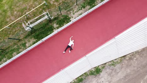 young-man-teen-feeling-love-and-freedom-metaphoric-shot-lying-on-vibrant-red-stripe