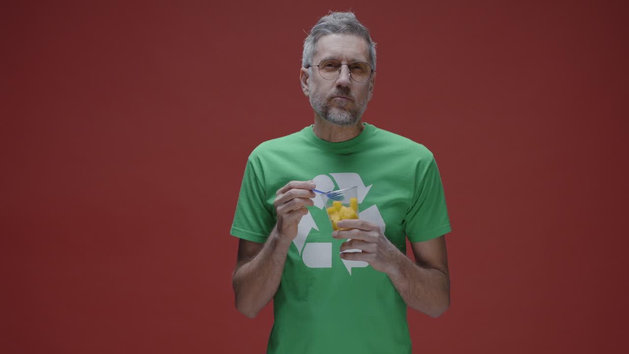 Man Eating Recycled Fruit Snack