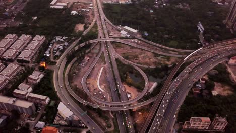 aerial view of highway junctions. bridge roads shape circle in structure of architecture concept. top view. urban city, bangkok at sunset, thailand.