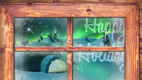 marco de la ventana contra el texto de las felices vacaciones y la nieve cayendo sobre el iglú en el paisaje de invierno