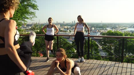 women exercising outdoors with city view