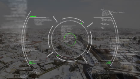 animation of circles, computer language over aerial view of snow covered modern city