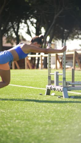 woman doing sled push exercise
