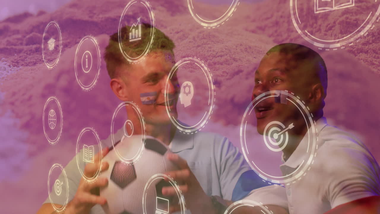 Holding soccer ball, two men with face paint and animation overlaying scene