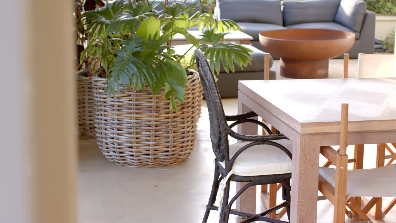 Wicker chairs surrounding marble table, inviting relaxation, copy space