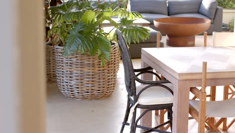 wicker chairs surrounding marble table, inviting relaxation, copy space