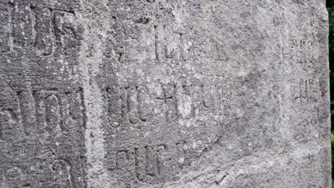 Ancient-Grabar-script-carved-into-stone-at-old-monastery-in-Armenia