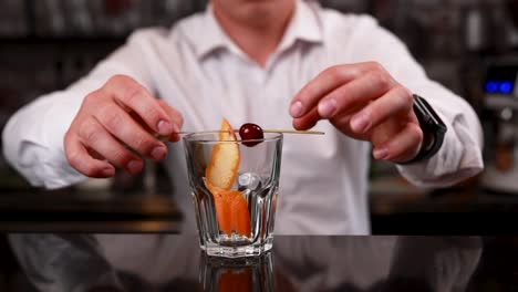 bartender preparing an old fashioned cocktail