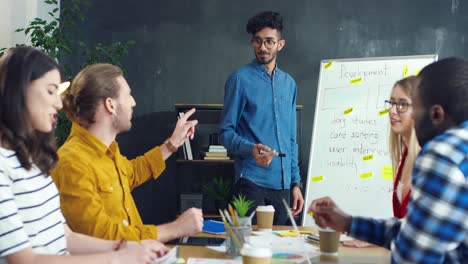 arabic young man explaining his report on business startup strategy in a meeting in the office