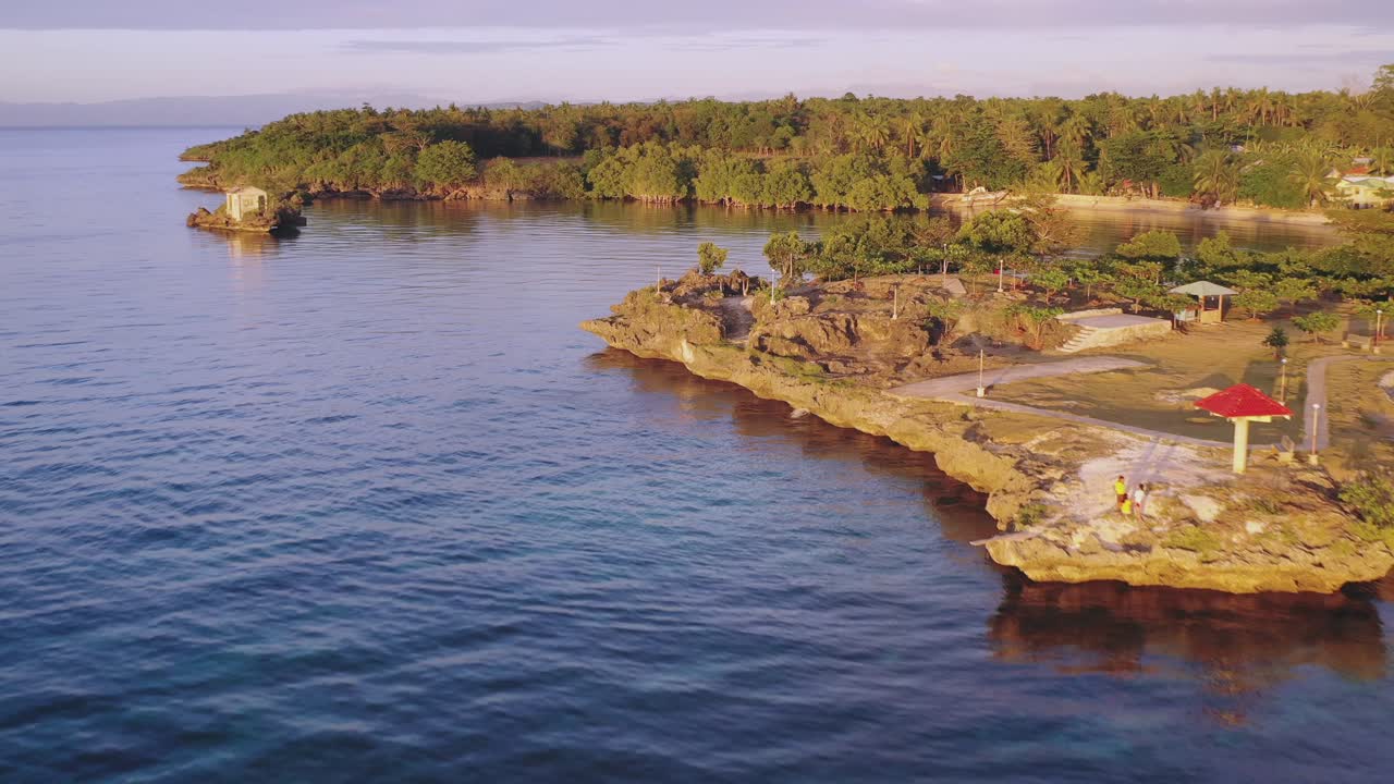 Wide angle dolly in drone shot of Boracay island, coastlines, and beach in the Aklan region of Phillipines during the day