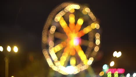 theme park at night. defocused spinning led lit attraction. 4k