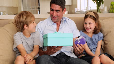 cute children giving their father presents