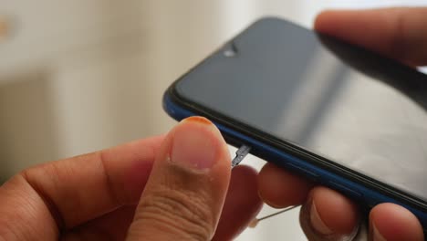 inserting a sim card into a smartphone