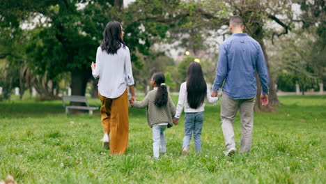 family, park and parents walking with children