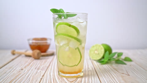 iced honey and lime soda with mint - refreshing drink