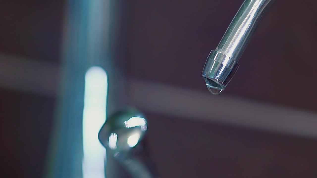 Water drips from the tap Slow motion