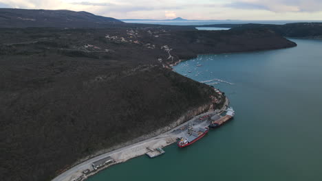 drone aerial port with boats river raša, rasa in trget sunset harbor