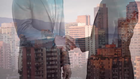 Composite-video-of-mid-section-of-businessman-and-businesswoman-shaking-hands-against-cityscape