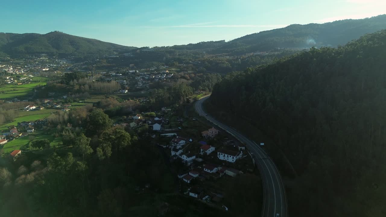 Scenic view of a motorway highway road winding through the green landscape near Arouca, Portugal. Modern transportation infrastructure connecting a European rural town
