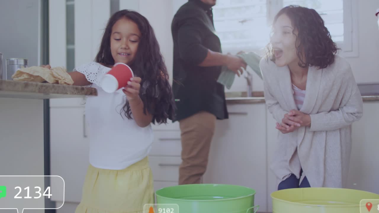 Girl sorting bottle into green bin placing cup and bag updating eco counters as parents cheering