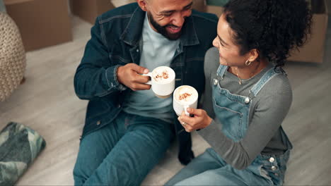 couple celebrating moving into new home with coffee