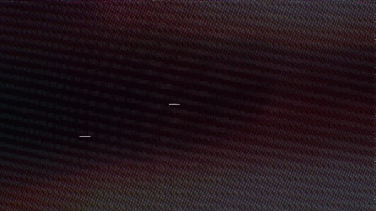Authentic VHS tape noise with color bleeding, scan lines, and static glitch effects. Seamless loop for creating a retro 80s or 90s television look. Use as an overlay or background