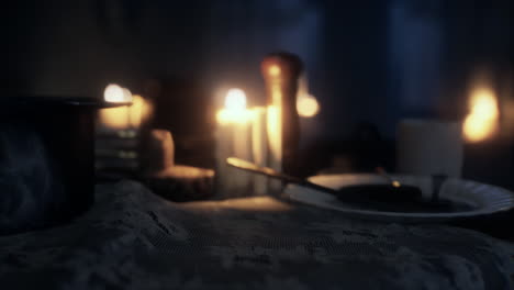 table setting in candlelight at night