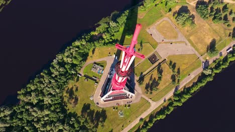 unique top-down drone view highlights vibrant red riga tv tower in full sun