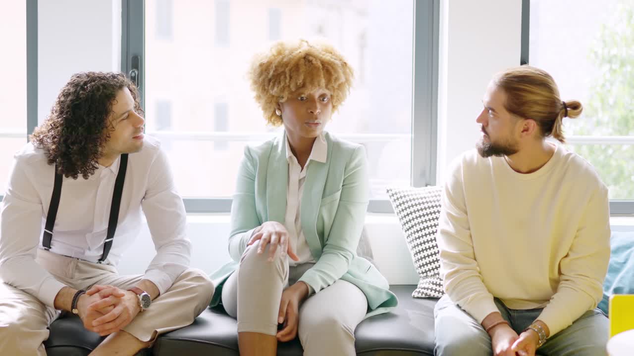 Coworkers talking distracted during a work break