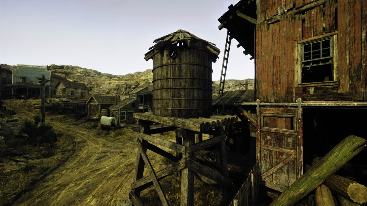 Old western town with wooden structures and dusty paths in daylight