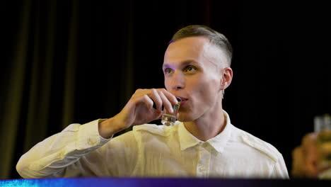 man drinking in a pub