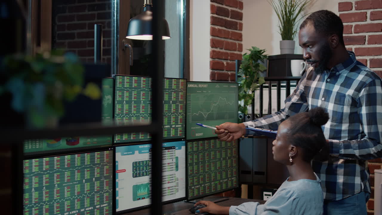African american team monitoring exchange market sales
