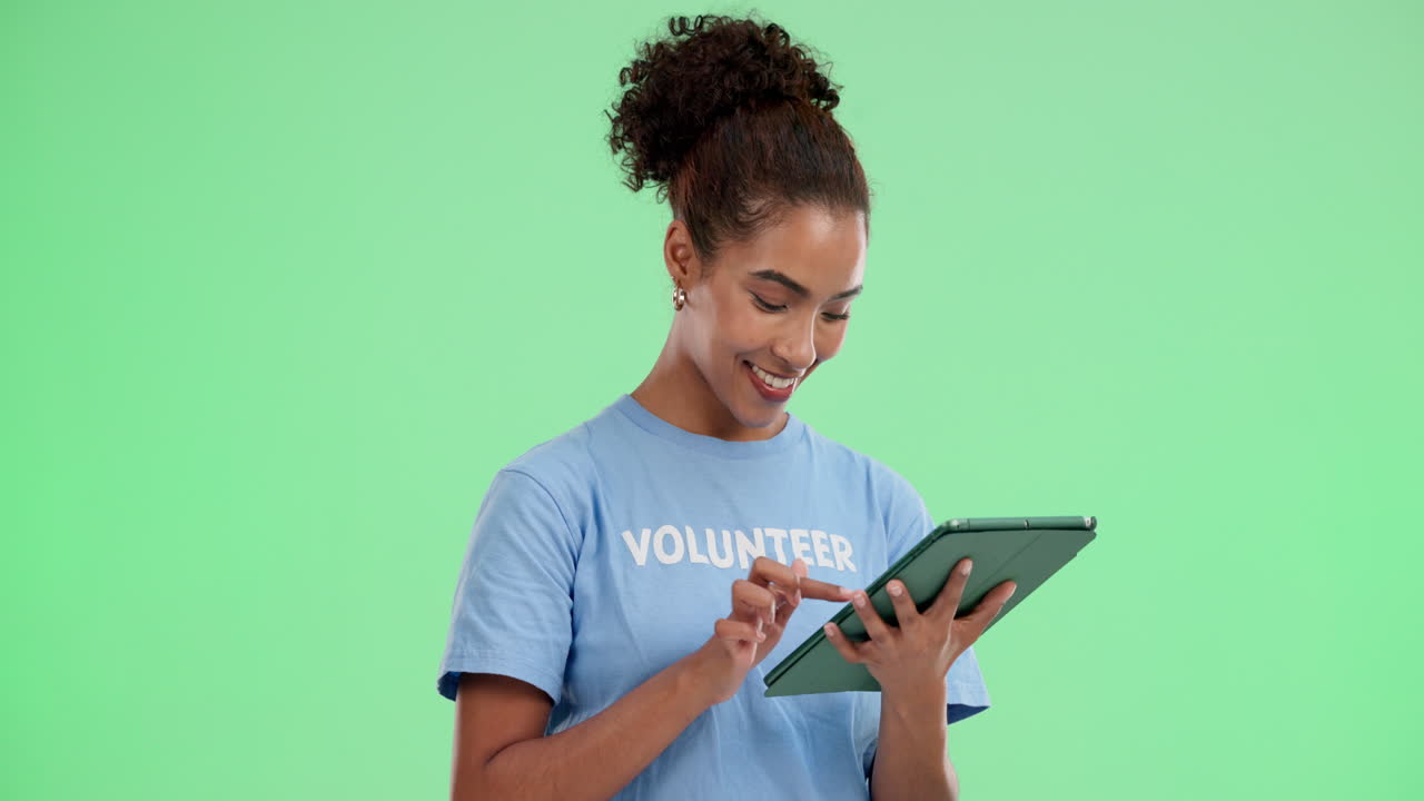 Young woman volunteering with a tablet