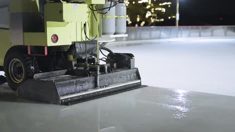 zamboni polishing an ice rink for ice skating and hockey