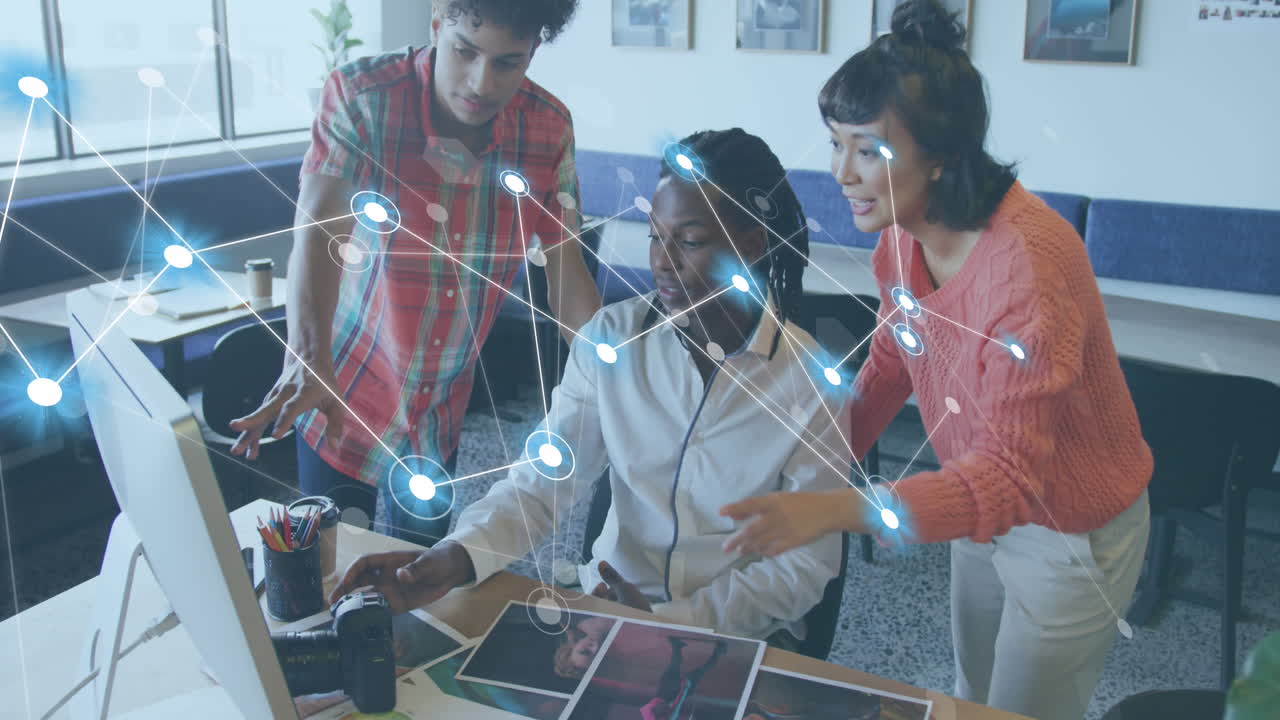 Animation of network of connections against diverse photographers discussing at office