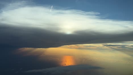 breathtaking view of a sunset over the mediterranean sea ,shot from an airplane cabin during a real flight