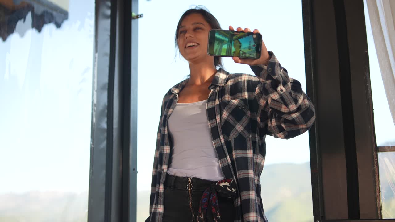 Woman taking a selfie in front of a beautiful view