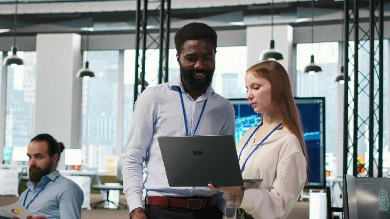 Junior Dev And Colleague In Office Reviewing Ai System Metrics