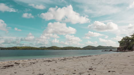 Low-Angle-Timelapse-Of-Clouds-And-White-Beach-On-An-Island-In-Palawan-Philippines