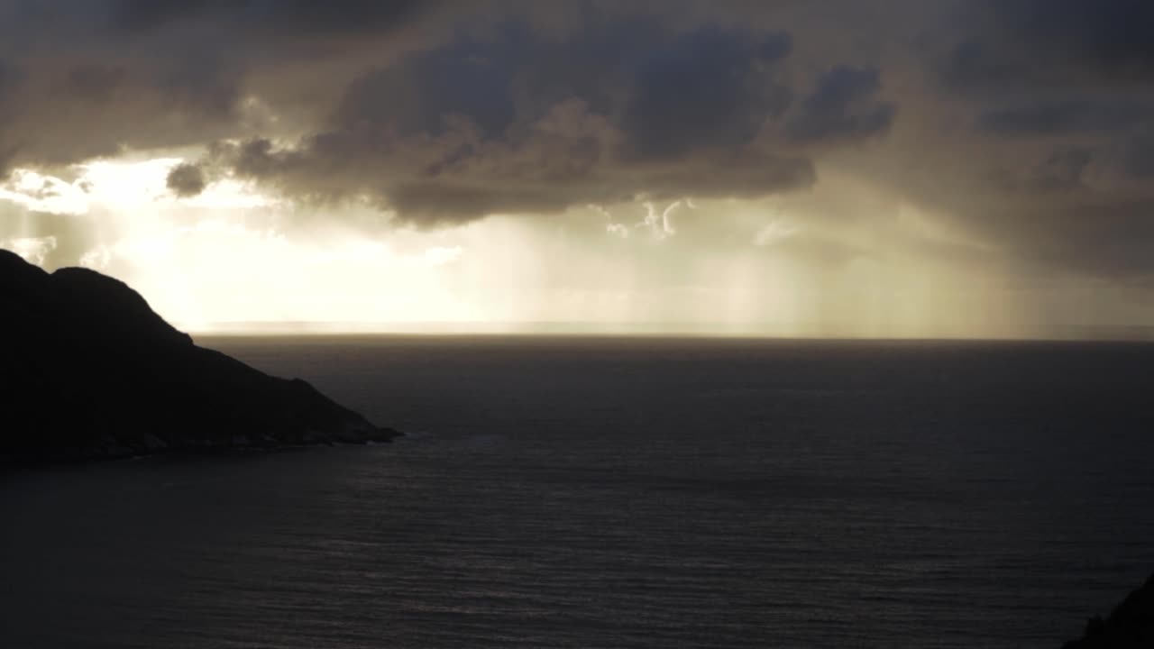 Seascape and mountains during sunset, coastline of Norway, handheld view