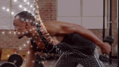 animación de manchas brillantes sobre un hombre fuerte haciendo ejercicio en el gimnasio