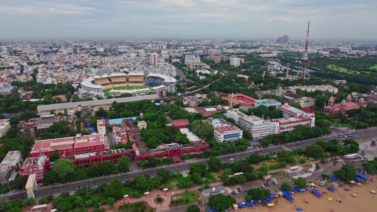 EZHILAGAM, public works department with chennai marina beach road and chidambaram stadium at triplicane, chennai, tamil nadu. daytime, pull back, drone shot, 4k.