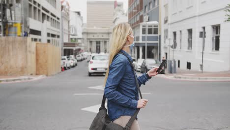 SIde-view-of-Caucasian-woman-on-the-go-wearing-a-coronavirus-Covid19-mask