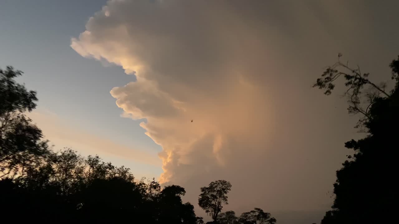 Storm clouds thunderstorm strike thunder lightning strike natural weather over Amazon forest