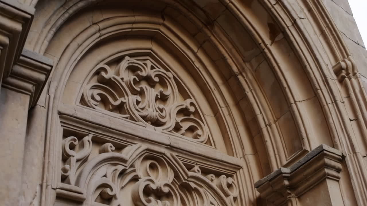 Ornate Stone Carvings on a Historic Archway Entrance