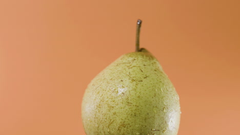 closeup shot of single passe crassane pear spinning fast