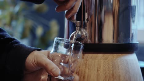 filling glass with water, clear purity, symbol of refreshment and health